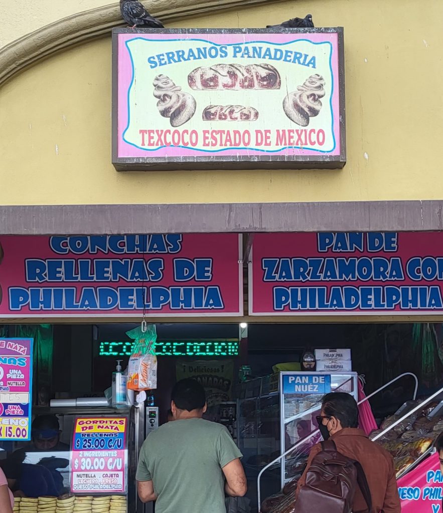A sign for Serranos Panaderia on the boardwalk in Ensenada.