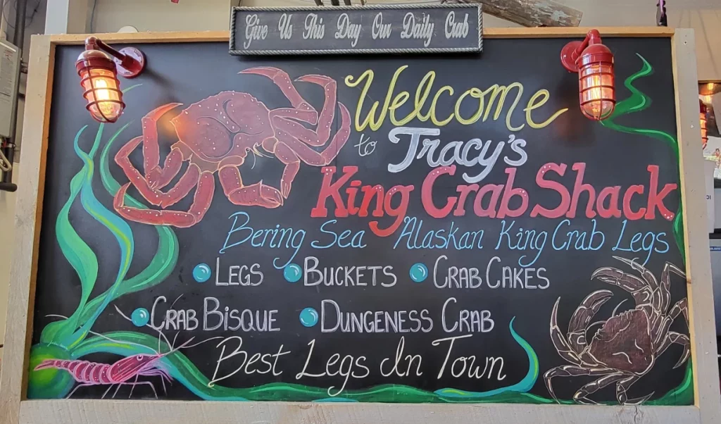 Chalkboard sign at Tracy's King Crab Shack in Juneau Alaska on a cruise.